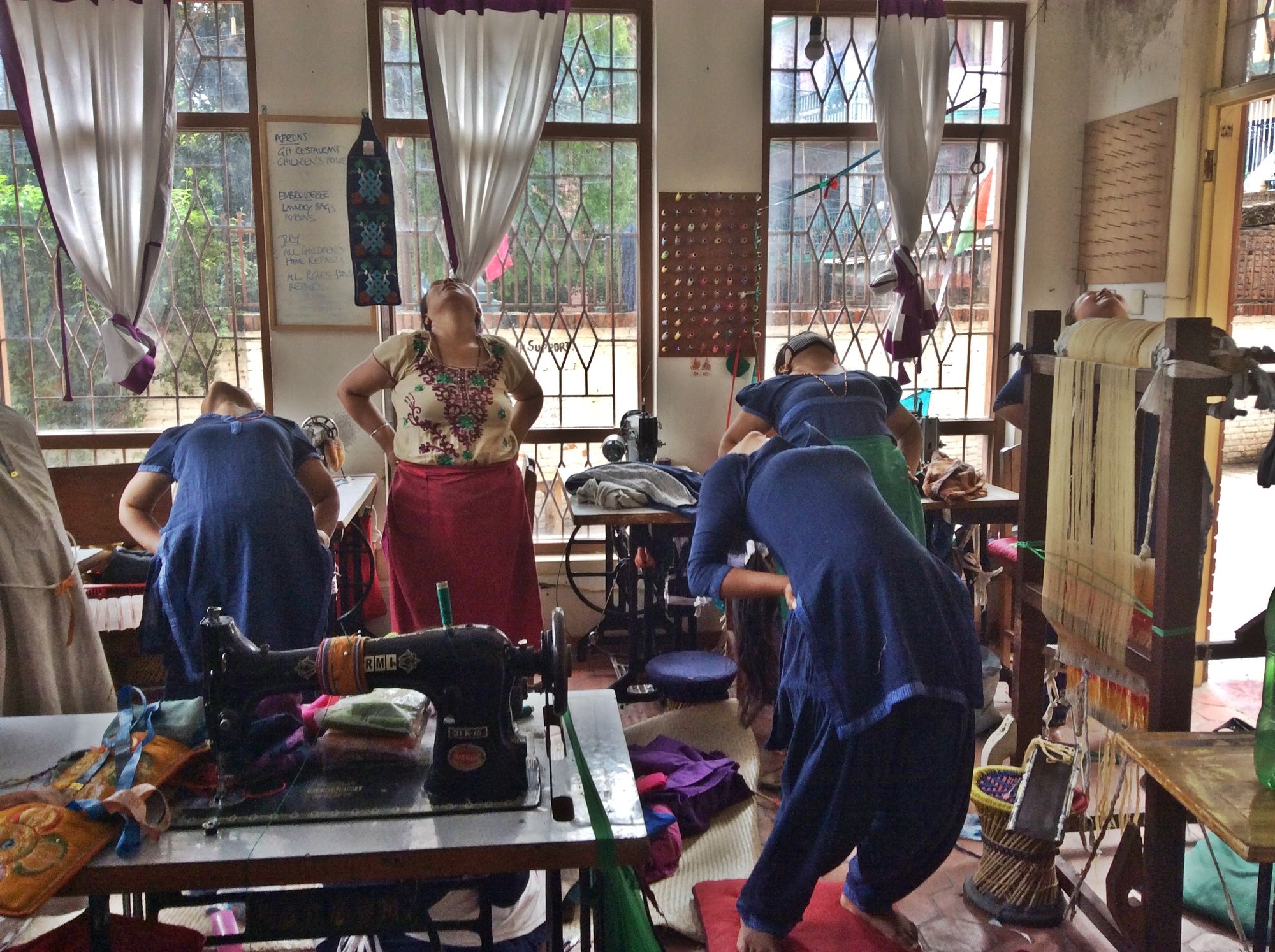 Teaching 'chair yoga' to a group of working women 