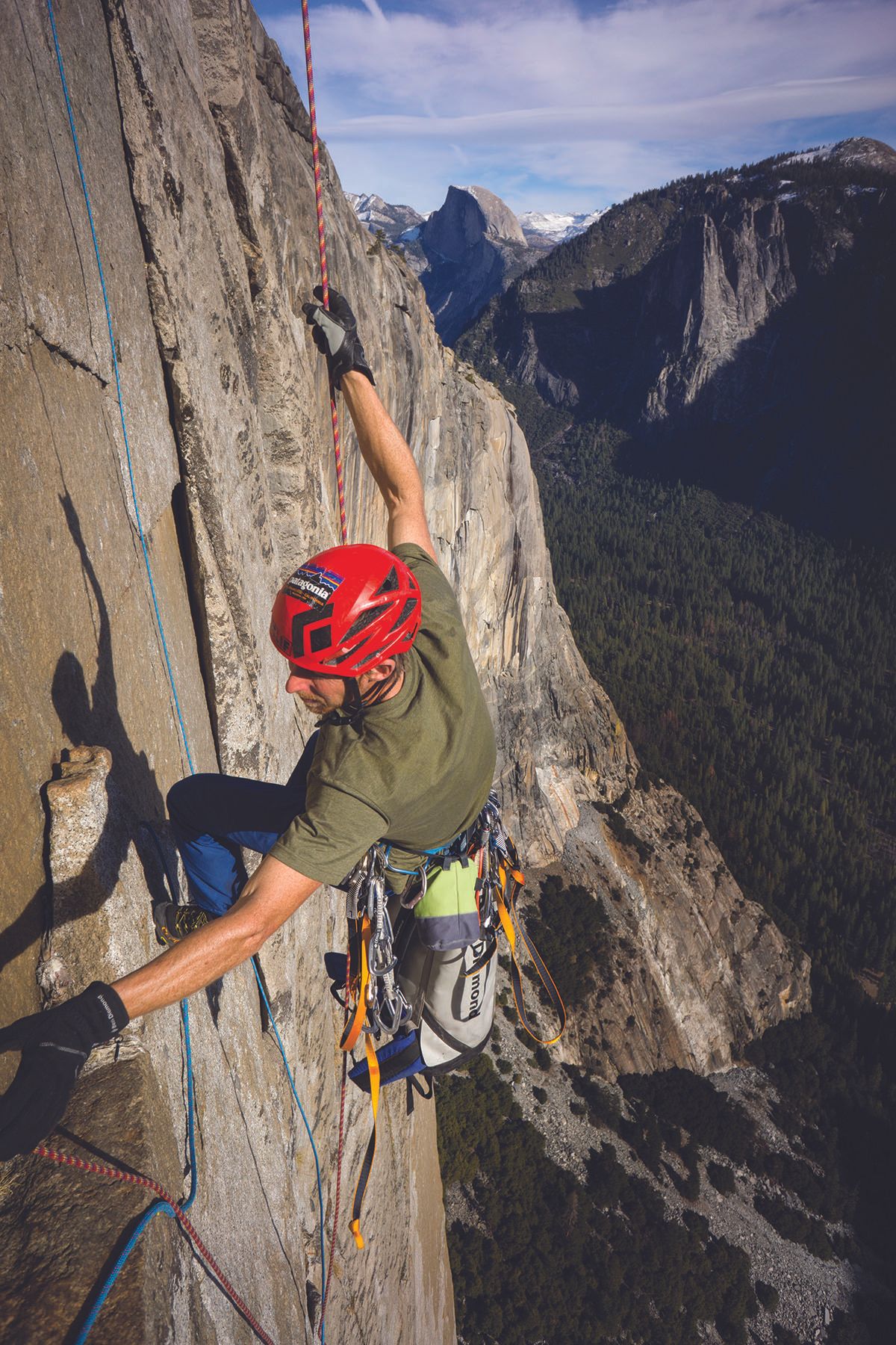 Tommy reaches for a rope on the wall.