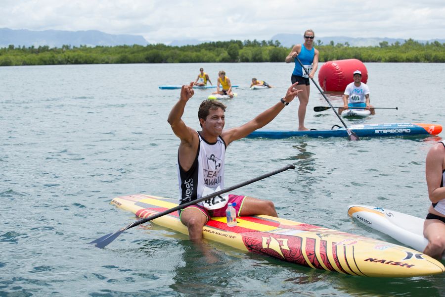 Kai Lenny passes his competition, pulling off an improbable come from behind victory for Hawaii in the Team Relay Race. Photo: ISA / Ben Reed