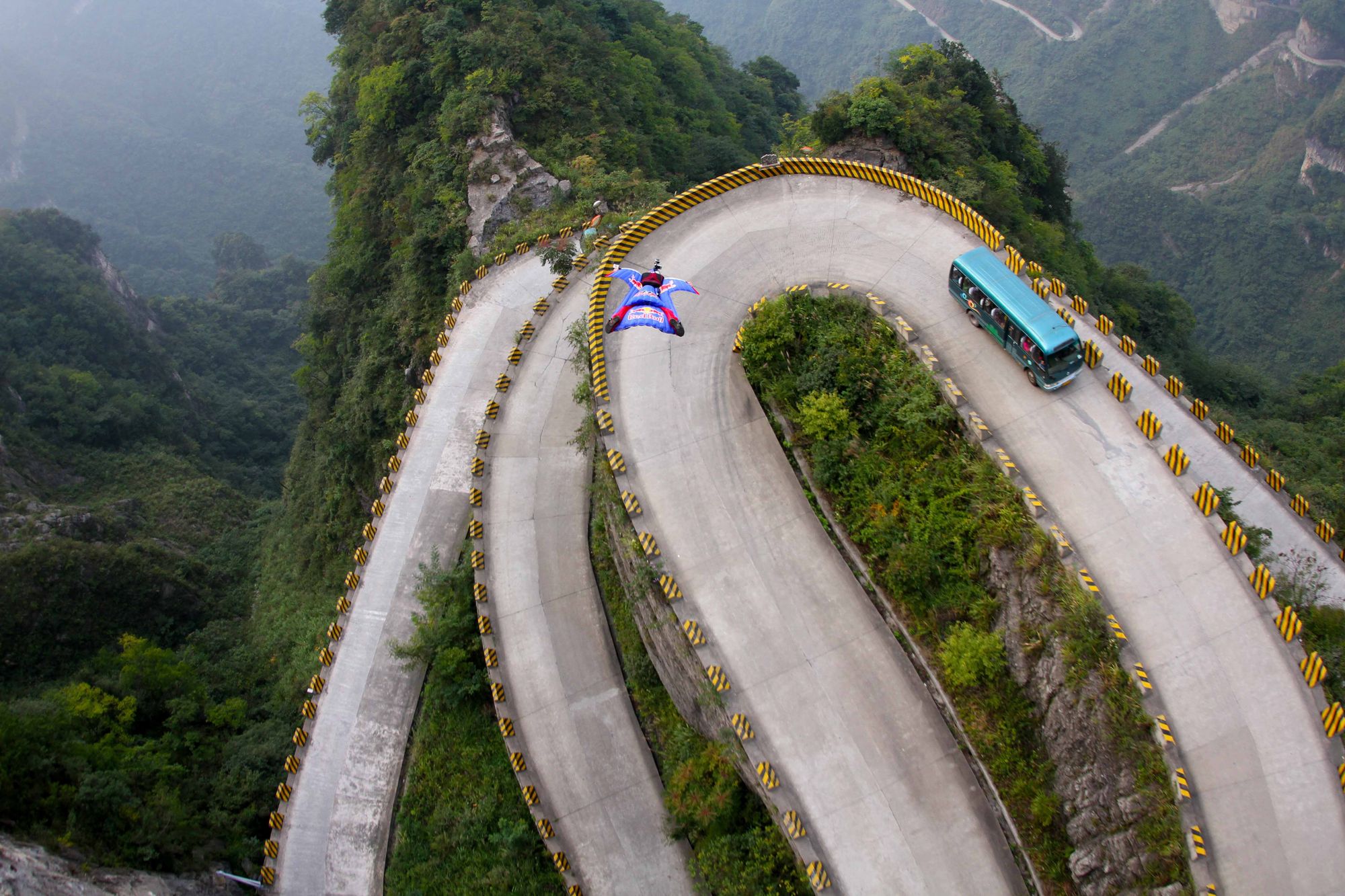 A surreal flight off Tianmen mountain in China's Hunan province. The World Wingsuit League held the first Wingsuit Championship here. Photo: Jeff Nebelkopf