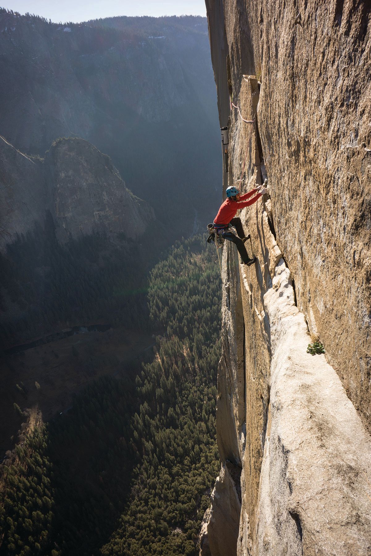 Kevin traverses along steep granite on his penultimate day on the wall.